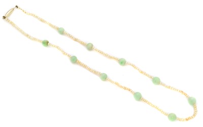 Lot 30 - A seed pearl and jade necklace
