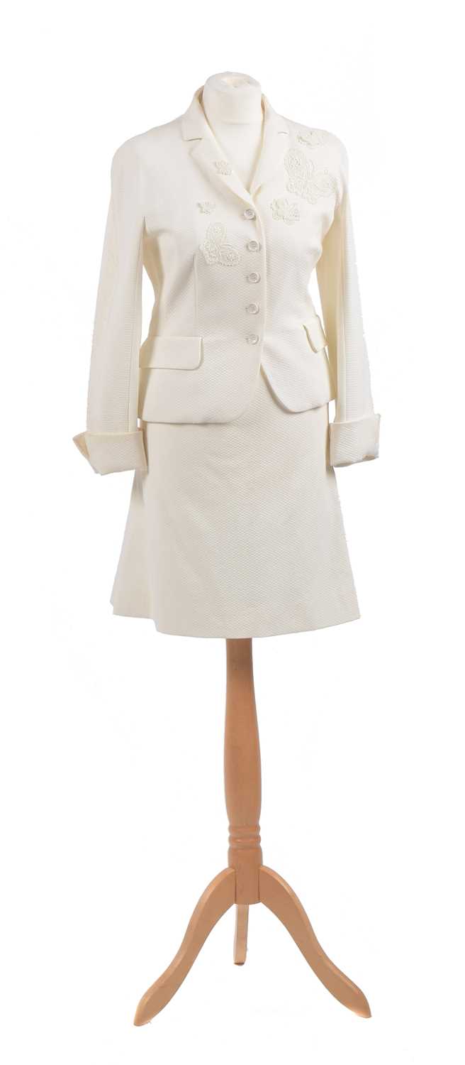 Lot A white suit by Moschino