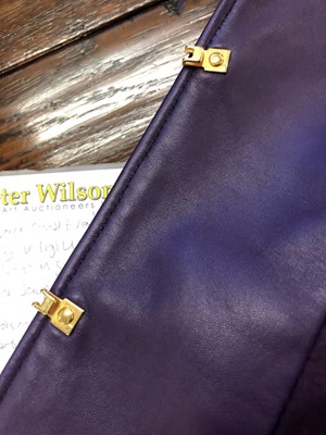 Lot 102 - An Escada purple leather set