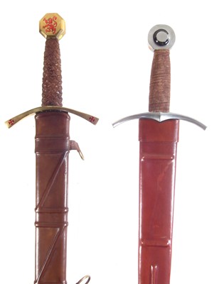 Lot 361 - Two modern replica swords and scabbards.