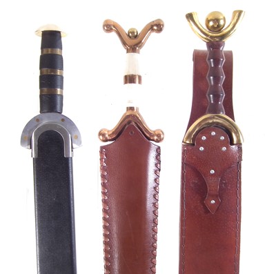 Lot 339 - Three modern replicas of Celtic swords and scabbards