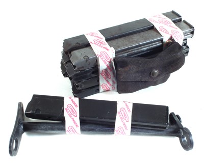 Lot 173 - Eight Sten gun magazines, pouch with loading tool, together with a Diecast stock, magazine, and 1911 magazine.