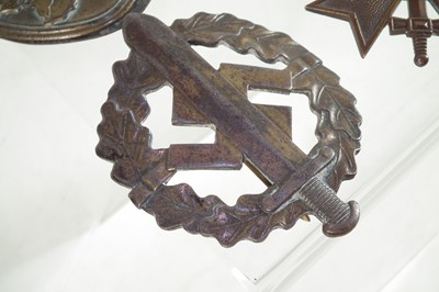 Lot 278 - Three German Third Reich badges and a medal