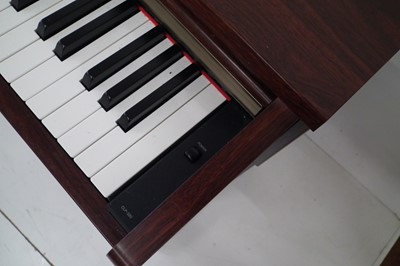 Lot 23 - Yamaha Clavinova electric piano, with stool and Sanyo headphones.