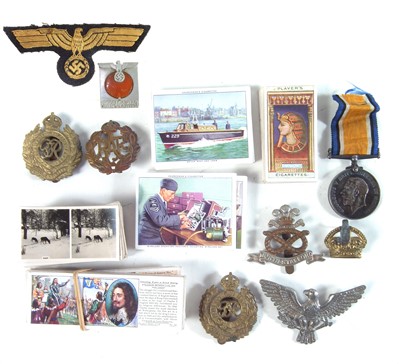 Lot 430 - Collection of cap badges, medal, and cigarette cards