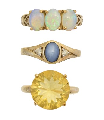Lot 147 - Three 9ct gold gem-set dress rings