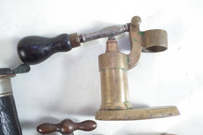 Lot 219 - Vintage shotgun reloading tools and two powder flasks.