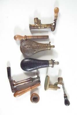 Lot 219 - Vintage shotgun reloading tools and two powder flasks.
