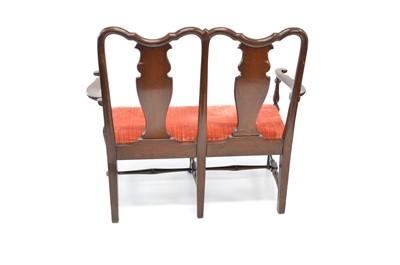 Lot 387 - Late 19th-century oak double chair back settle