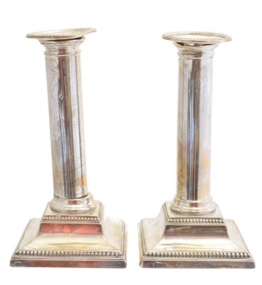 Lot 148 - A pair of Edward VII silver candlesticks