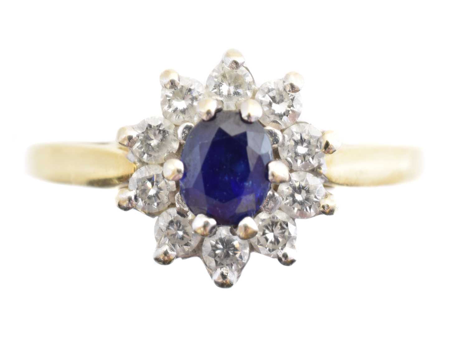 Lot 225 - An 18ct gold sapphire and diamond cluster ring
