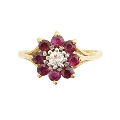 Lot 143 - An 18ct gold ruby and diamond cluster ring