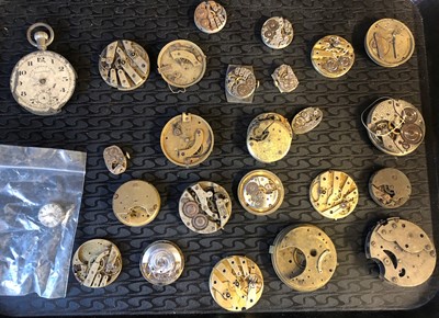 Lot 61 - A box of pocket watch and wristwatch movements and parts