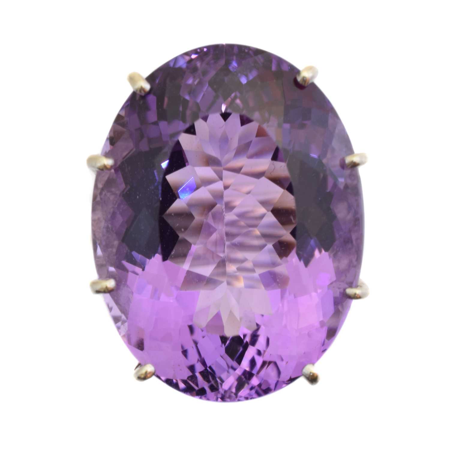 Lot 235 - A 9ct gold amethyst and diamond dress ring