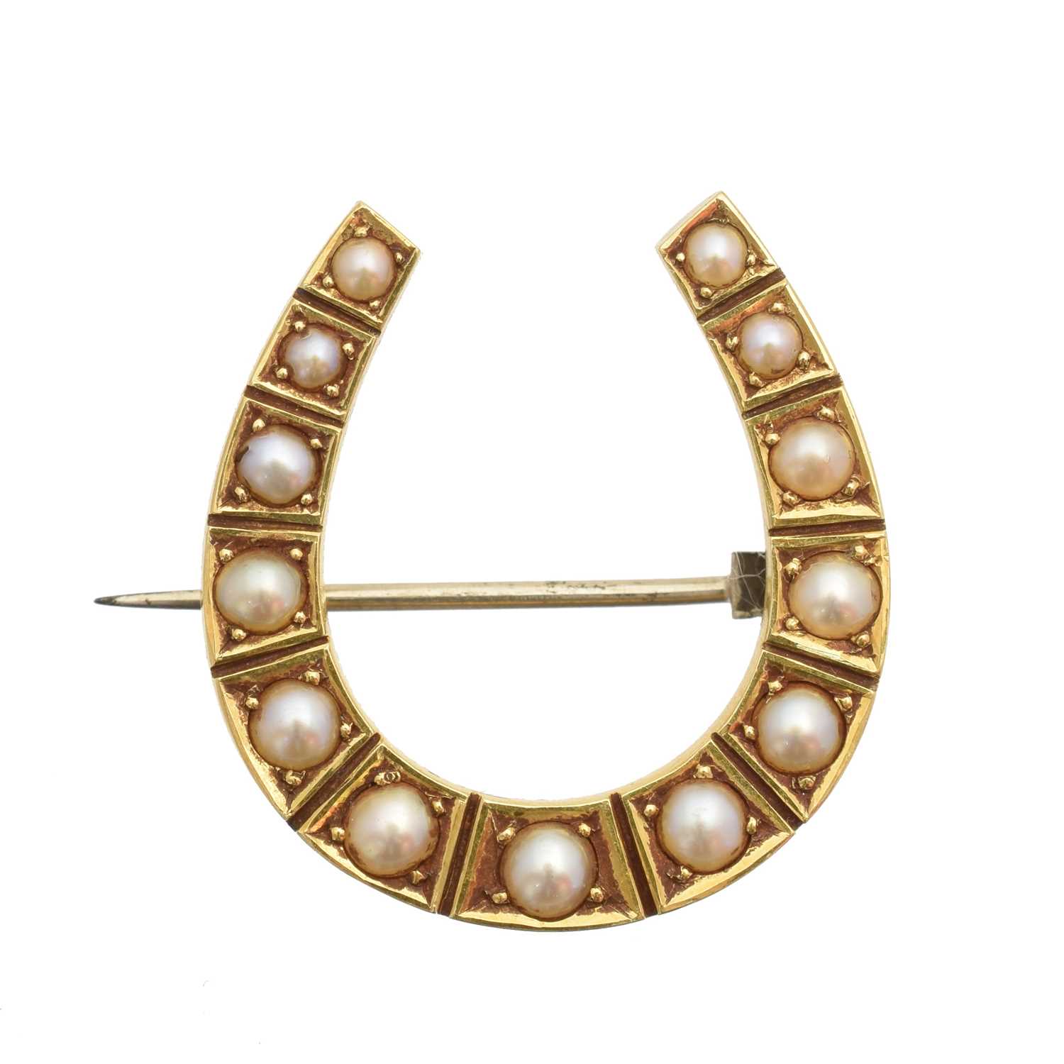 Lot 17 - A split pearl horseshoe brooch