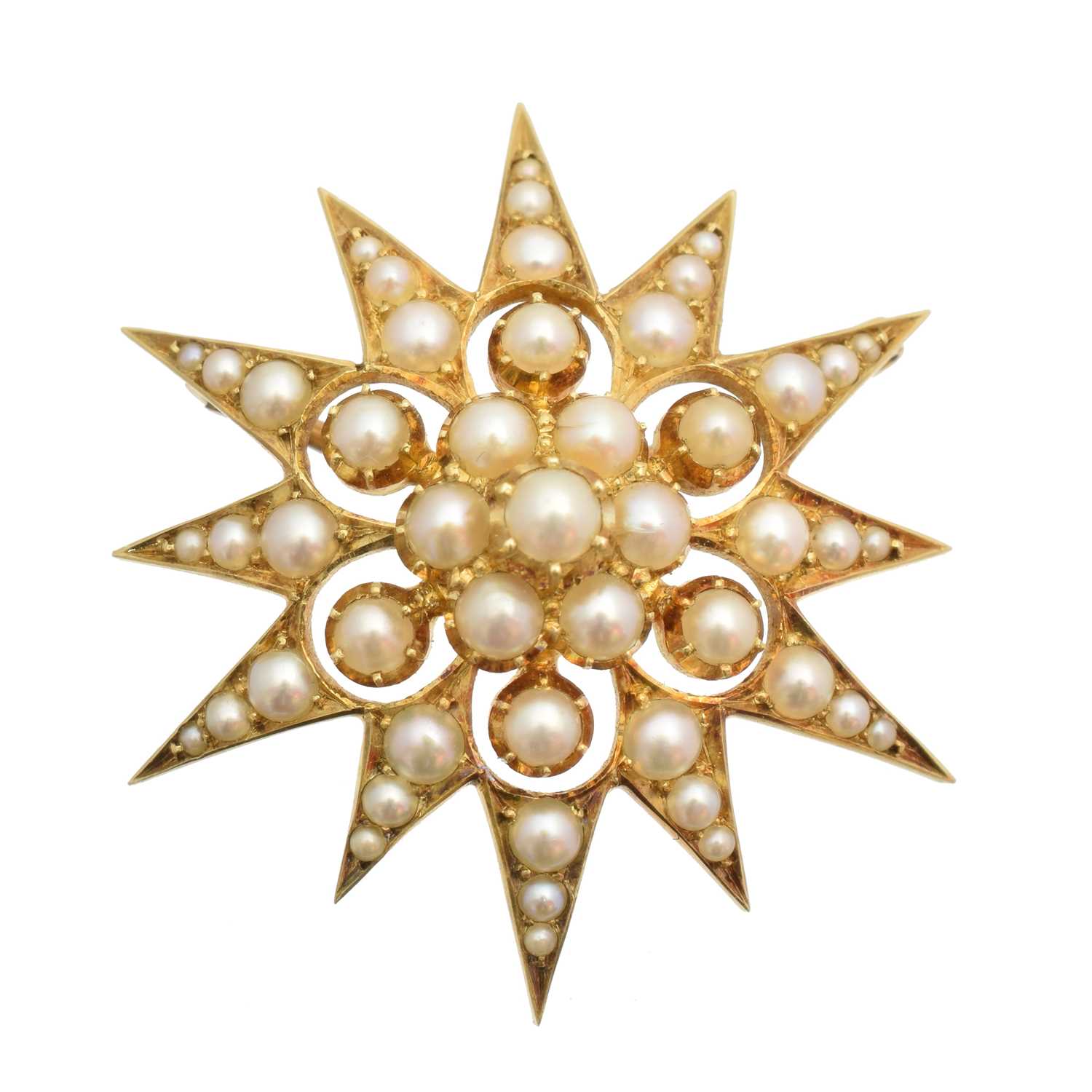 Lot 49 - An early 20th century split pearl star brooch