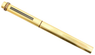 Lot 250 - A Cartier gold plated Trilogy pen