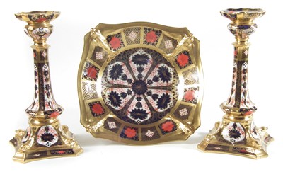 Lot 271 - Pair of Royal Crown Derby imari candlesticks and a footed bowl