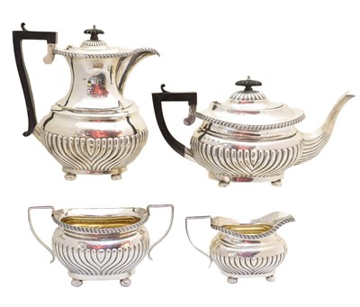 Lot 180 - An Edward VII silver four piece tea set