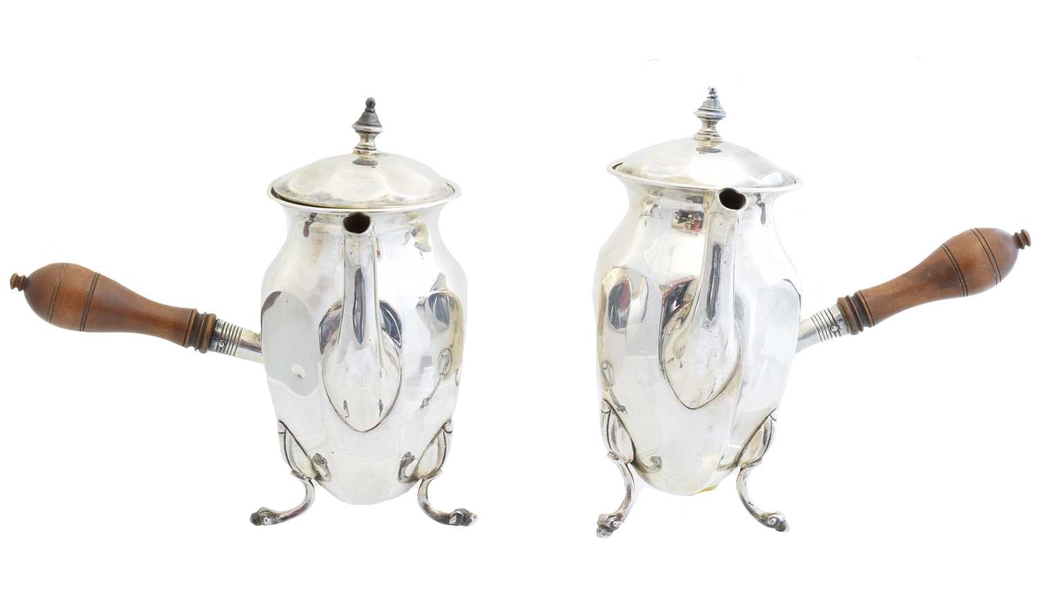 Lot 181 - A pair of George V silver chocolate pots