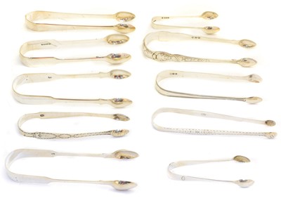 Lot 224 - A large selection of George III and later silver tongs