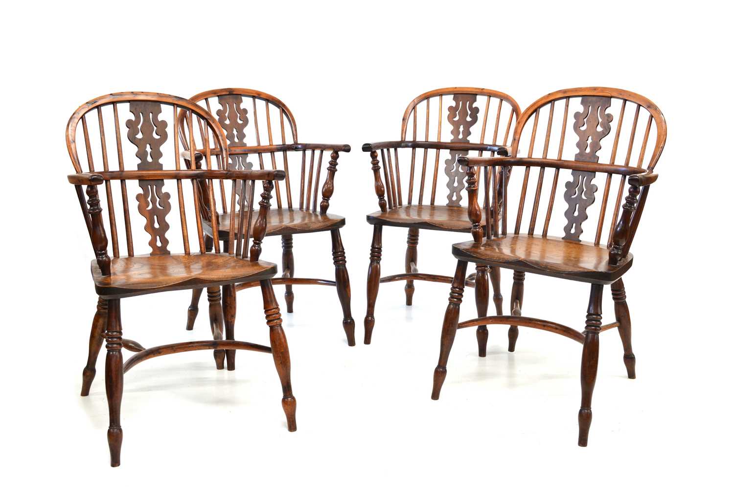 Lot 376 - Four mid 19th Century yew and elm low back Windsor chairs