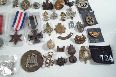 Lot 254 - Approximately seventy five Cap badges