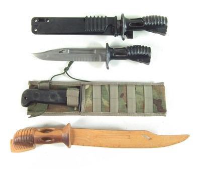 Lot 425 - Two SA80 bayonets, a carved wood copy and a survival knife