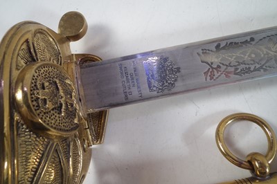 Lot 223 - 20th century replica Royal Navy ERII officers sword and scabbard.
