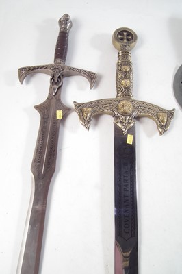 Lot 225 - Three 20th century mythical swords, also two pole axes.
