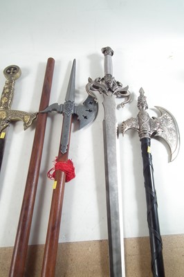 Lot 225 - Three 20th century mythical swords, also two pole axes.