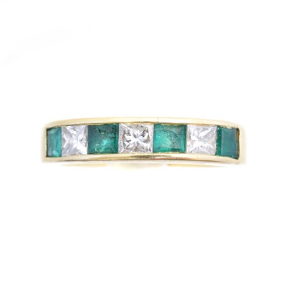 Lot 93 - An 18ct gold emerald and diamond band ring