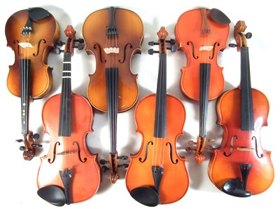 Lot 21 - Six Chinese violins in cases