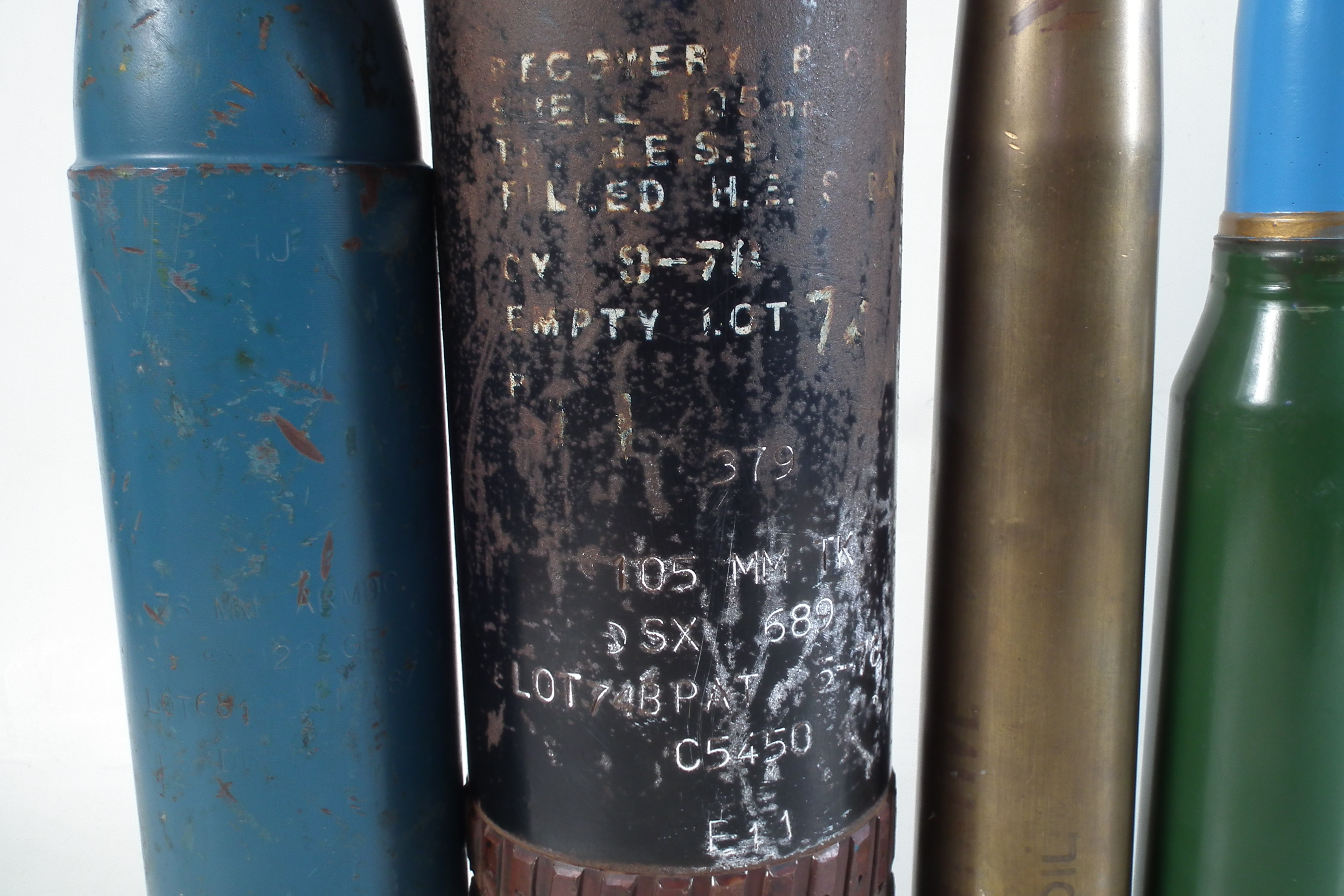 Lot 389 - Two inert shell heads and three artillery