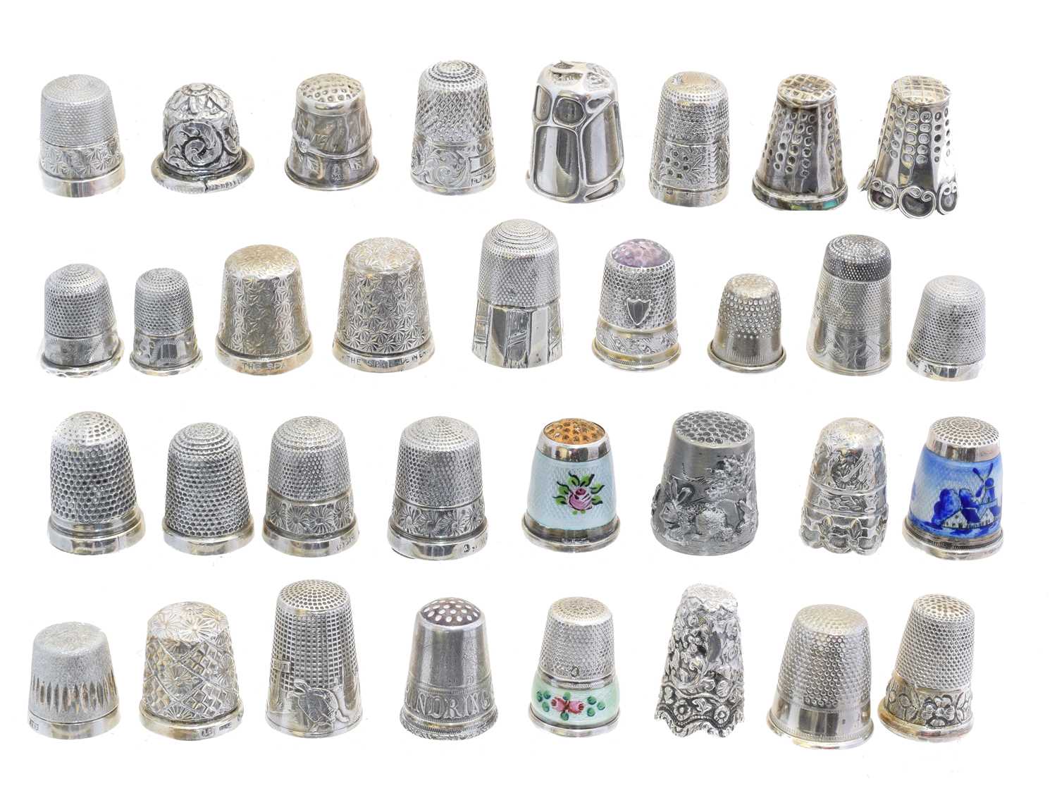 Lot 114 - A large selection of silver and white metal thimbles