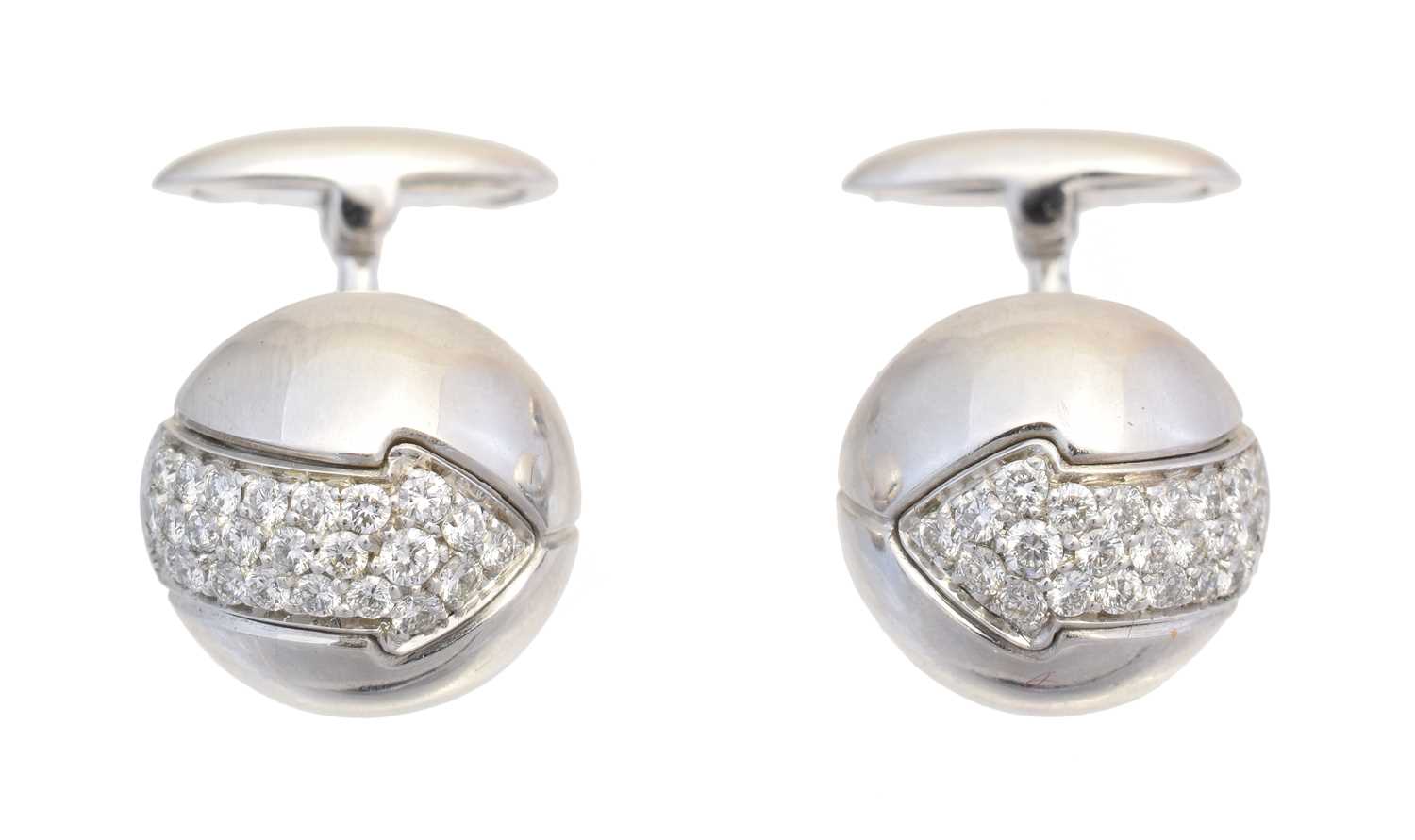 Lot 127 - A pair of diamond cufflinks by Enigma