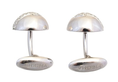 Lot 127 - A pair of diamond cufflinks by Enigma