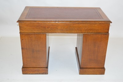 Lot 286 - Edwardian oak twin pedestal desk