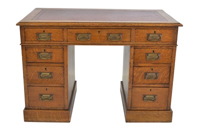 Lot 286 - Edwardian oak twin pedestal desk
