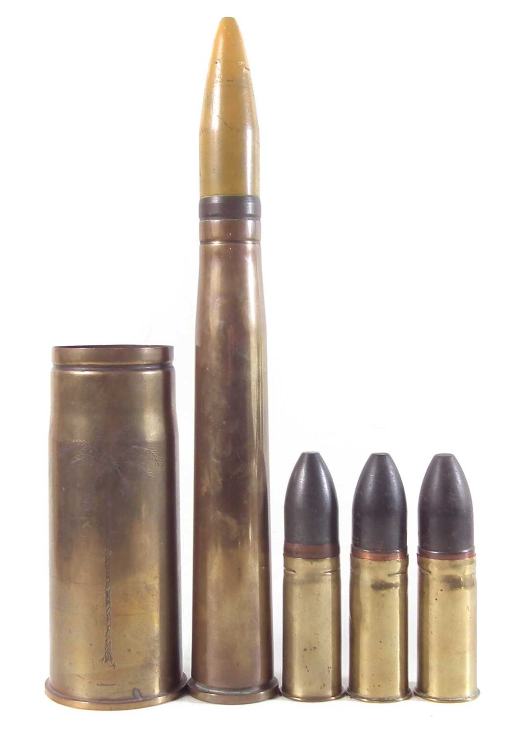 Military brass 76mm shell casing, 57mm bullet, a 48mm bullet, a 3 1/4  cannon ball and a faux 4 can - Ward's Auctions