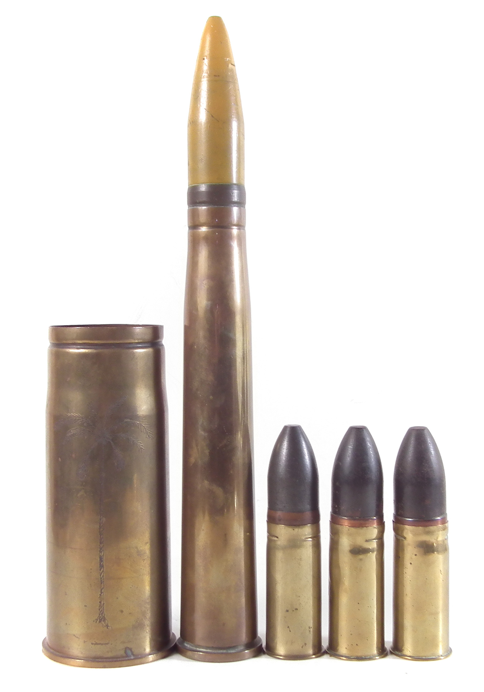 Lot 386 - Four artillery shells and a case.