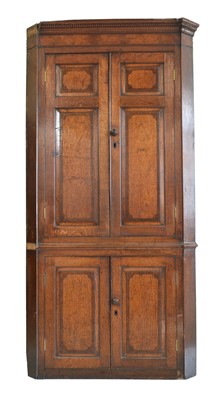 Lot 281 - George III oak corner cupboard