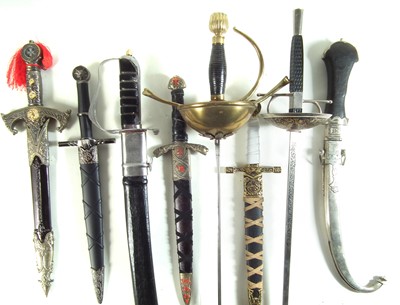 Lot 432 - Five reproduction daggers, a sword and two rapiers