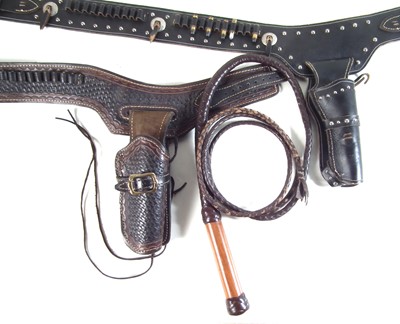 Lot 457 - Two leather Western style revolver rigs