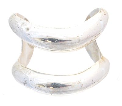 Lot 23 - A silver cuff bangle by Elsa Peretti for Tiffany & Co.
