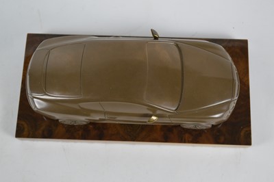 Lot 40 - bronzed resin desk ornament of a Bentley Continental GT on a lustrous wooden base