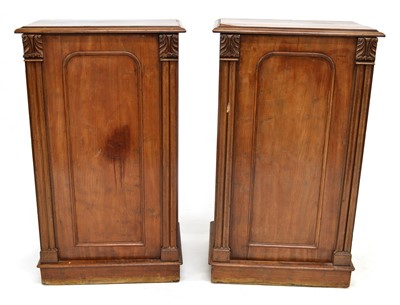 Lot 282 - A pair of figured mahogany bedside lockers