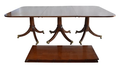 Lot 304 - A well-made Regency style mahogany three pedestal dining table with two leaves