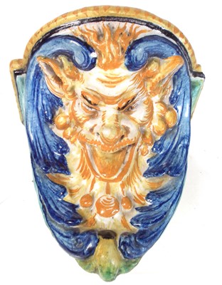 Lot 125 - Cantagalli wall bracket in the form of a devil mask, 19th century.