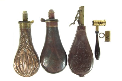 Lot 322 - Three flasks and two measures